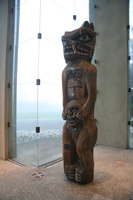 a totem with two face masks 